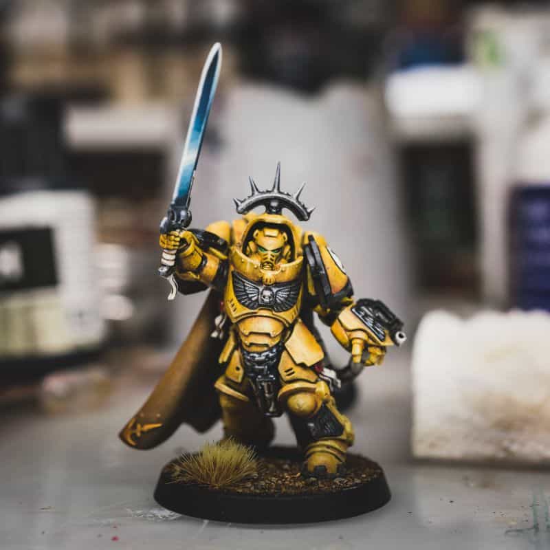 How to Photograph Miniatures with a Black Background (Guide) - how to capture miniature photos with pure black backdrops - infinite black backgrounds in miniature and model photography - guide for pure black background miniature photography - imperial fist space marine primaris subject