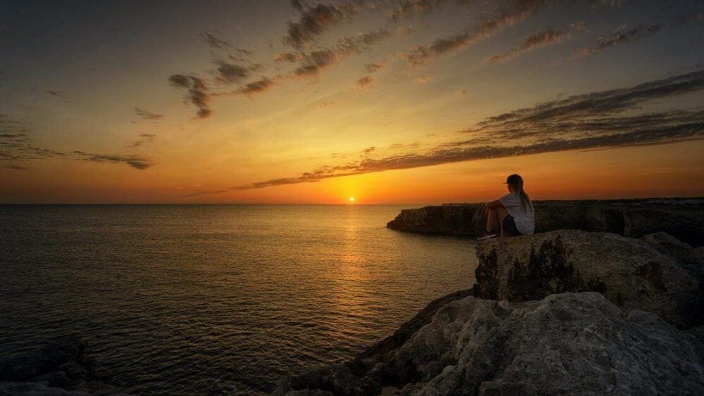 33 Reasons You Need To Take Photography, Seriously - personal reasons for photography - why photography - hobby photography -photo of person sitting on rock during sunset