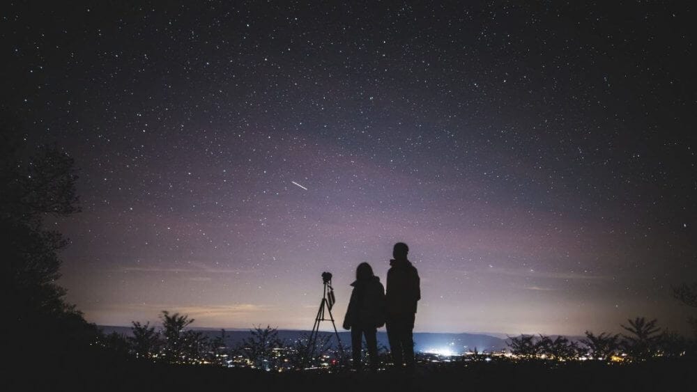 33 Reasons You Need To Take Photography, Seriously - personal reasons for photography - why photography - hobby photography -- silhouette of two persons stargazing