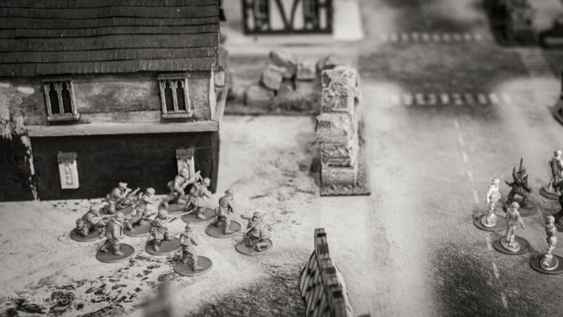 Is historical wargaming dying? Historical miniature gaming popularity - Bolt Action miniature historical WW2 game in progress black and white photo
