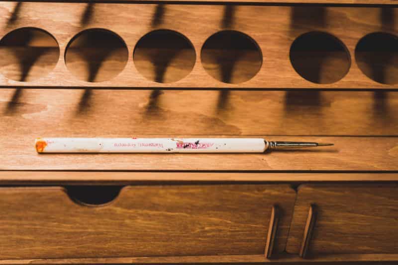 lay brush sideways on shelving