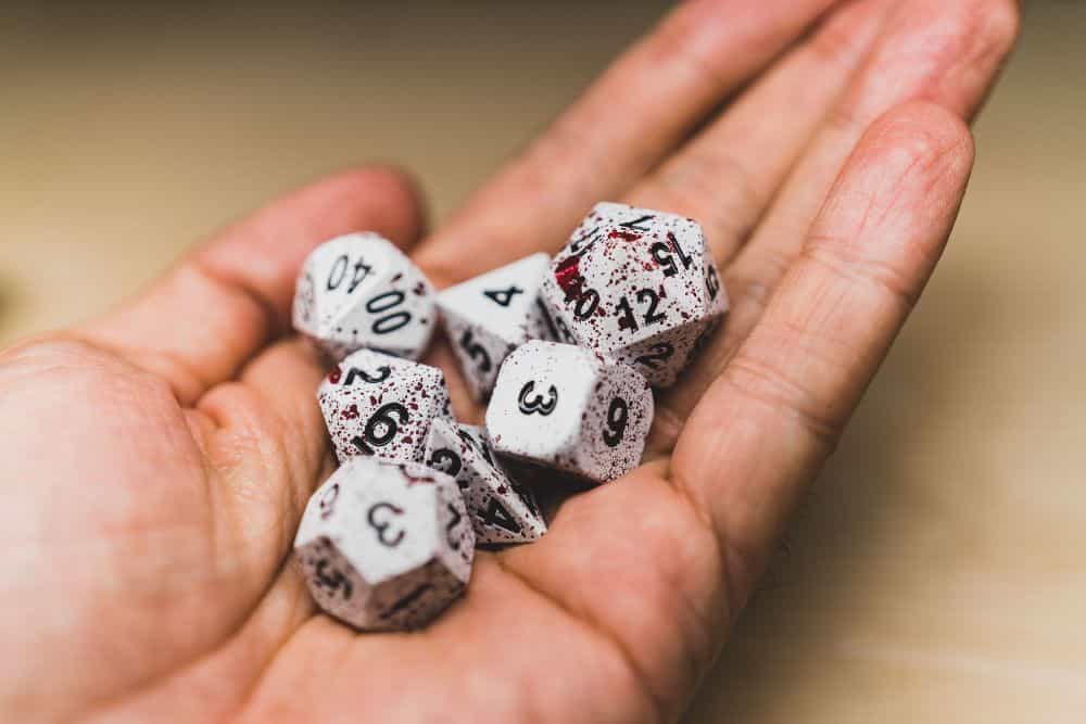 Best Metal Dice Sets? Forged Gaming Dice Sets for DnD and RPGs (Review) - metal dice set review - dice in hand