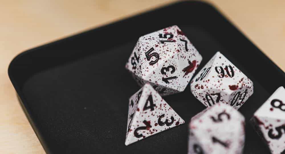 Best Metal Dice Sets? Forged Gaming Dice Sets for DnD and RPGs (Review) - metal dice set review - close up blood effects