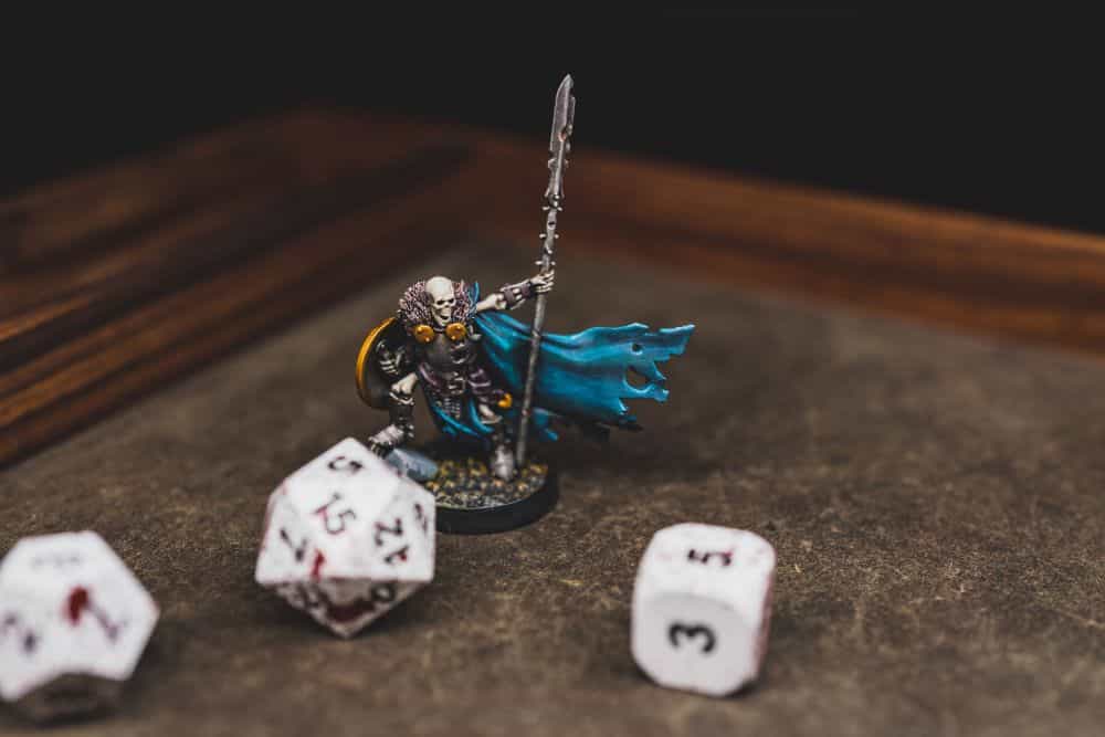Best Metal Dice Sets? Forged Gaming Dice Sets for DnD and RPGs (Review) - metal dice set review - miniature skeleton
