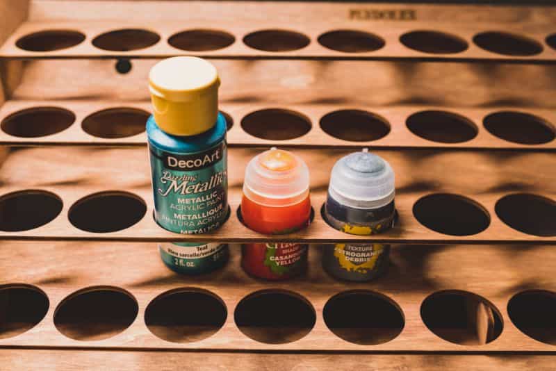 Wall mounted paint rack and organizer - best wall mounted paint rack - paint racks for walls - paint bottles in shelf