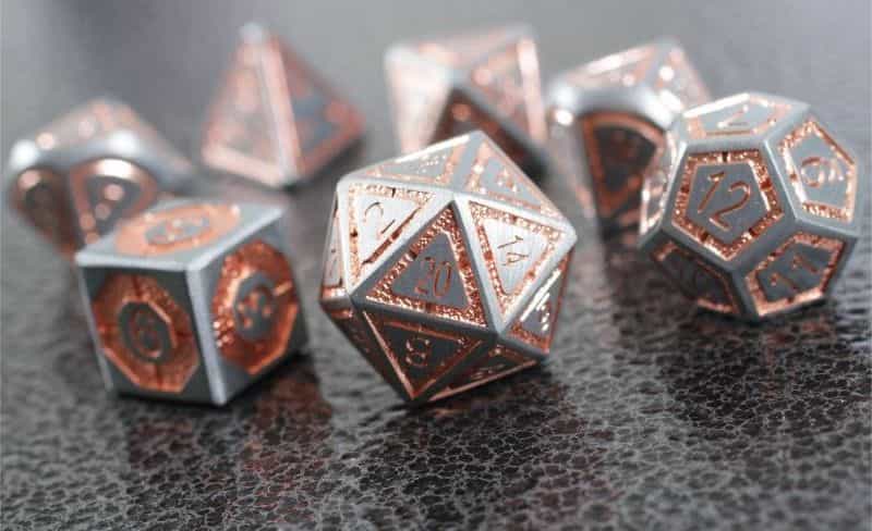 The Best D&D Dice Sets for Every Budget: 15 Cool Dice for RPGs - cool dnd dice - d20 dice for RPGs - best dice for D&D - dice for dungeons and dragons - steel and copper celestial artifact forged gaming dice set