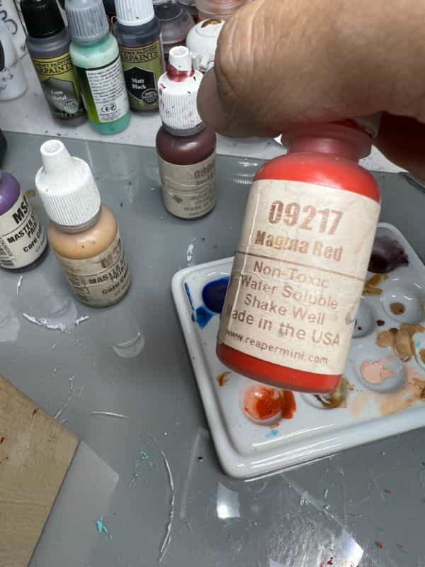 How to Paint a 3D Printed Resin Miniature A-to-Z (Flesh, Cloth, and Metal) - how to paint myminifactory model - orange highlights on the cloth