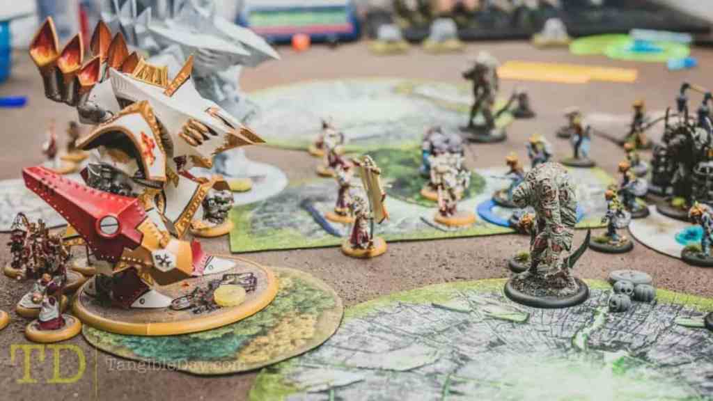 Why Should You Play Warmachine and Hordes? - Is Warmachine Hordes miniatures game fun to play - reasons to play warmachine hordes miniatures tabletop game - gameplay ending with colossal versus warbeast grymkin