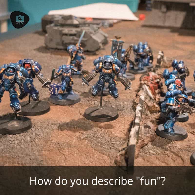 Why I Enjoy Tabletop Miniature Wargaming - tabletop games better than video games - reasons I enjoy wargaming with miniatures - fun concept image with models from warhammer 40k