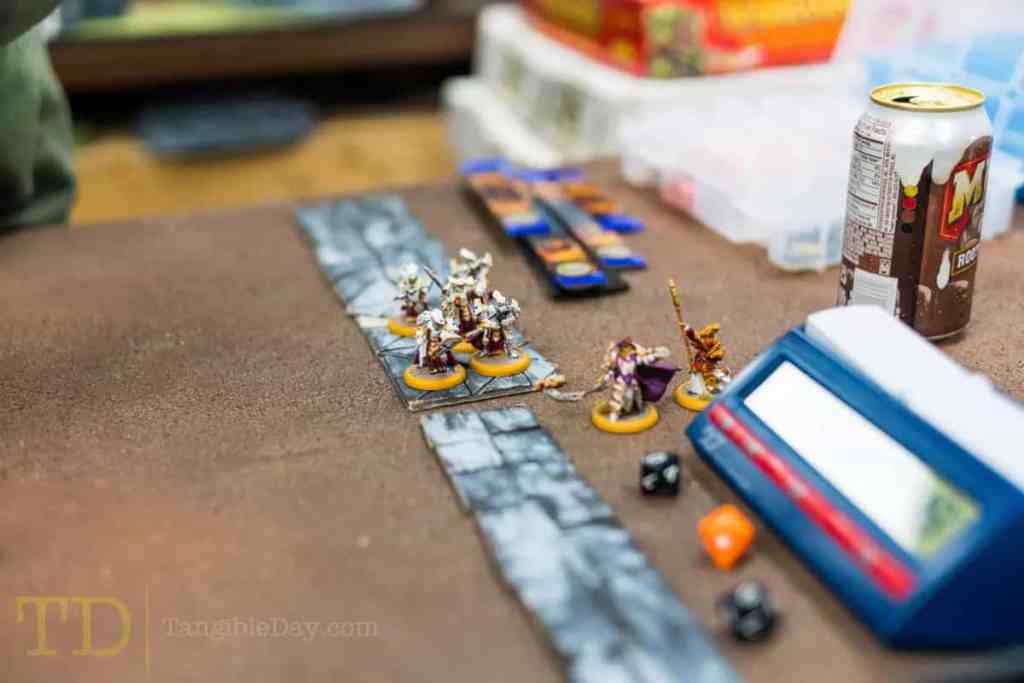 Why Should You Play Warmachine and Hordes? - Is Warmachine Hordes miniatures game fun to play - reasons to play warmachine hordes miniatures tabletop game - clock and menoth models