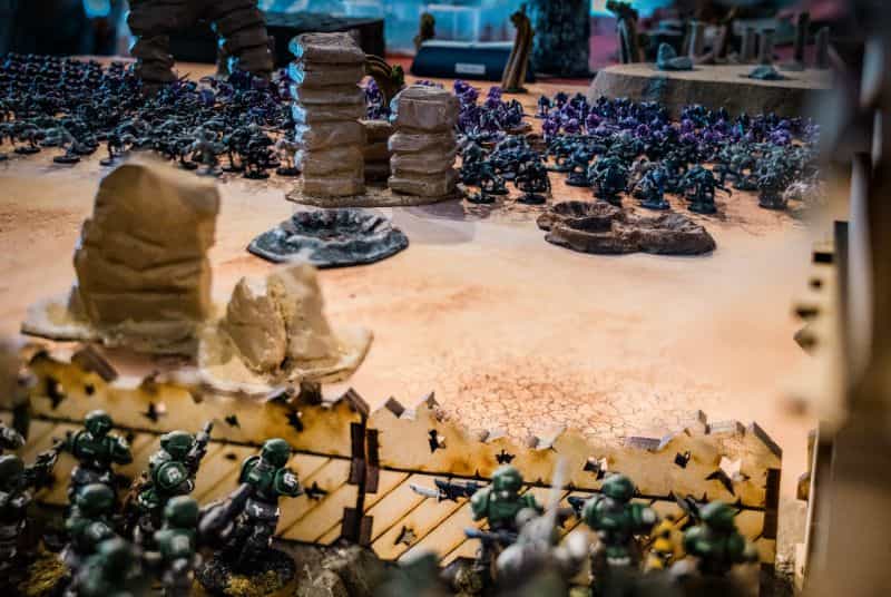 The History of Tabletop Wargaming - Miniature wargaming history through the ages, milestones and key points - an epic standoff between aliens and humans on a miniature battlefield