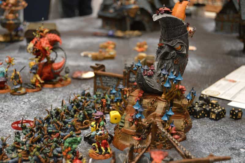 The History of Tabletop Wargaming - Miniature wargaming history through the ages, milestones and key points - Warhammer Fantasy Battles with orcs and goblins colorful display on the tabletop 
