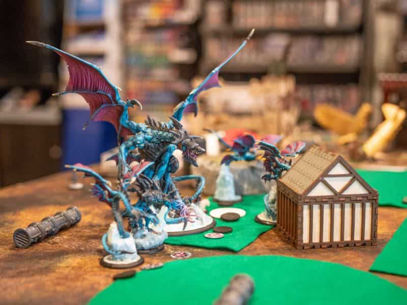 The History of Tabletop Wargaming - Miniature wargaming history through the ages, milestones and key points -  A game piece dragon in Warmachine Hordes looks terrifying