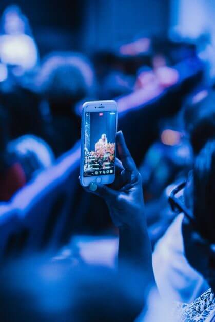 person holding smartphone - Psychological Reasons to Use Good Hobby Lighting: Motivation and Focus - motivation and focus for hobbies and miniature painting