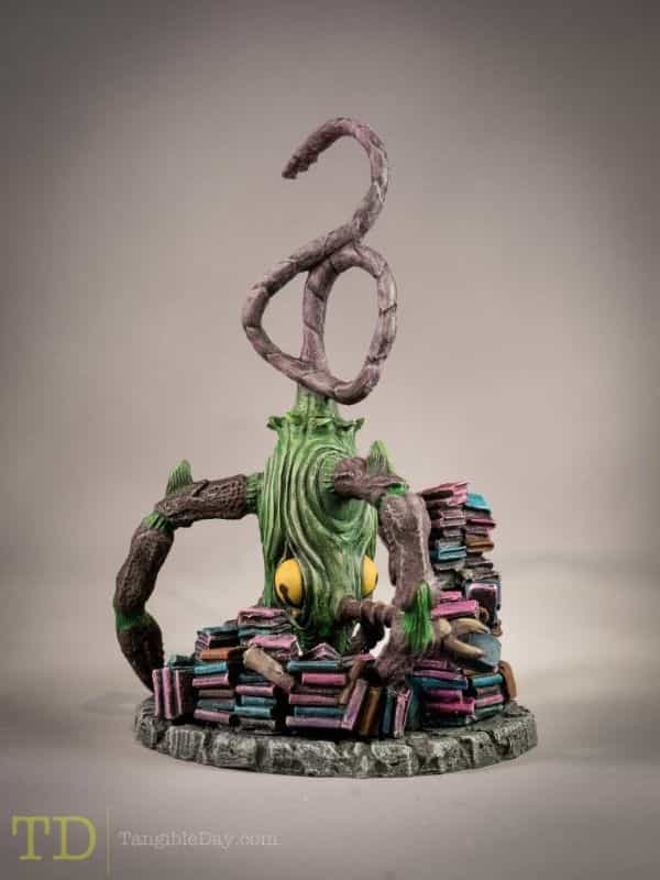 The power of creative limitations - creative limitation - how to use limitations to work more creatively - Cthulhu board game miniature with books lying around.