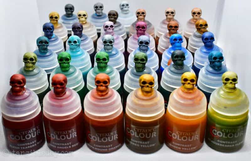 Zenithal Priming and Painting Miniatures – A Tutorial - painting minis with zenithal contrast - Citadel Colour contrast pots with exampled skulls