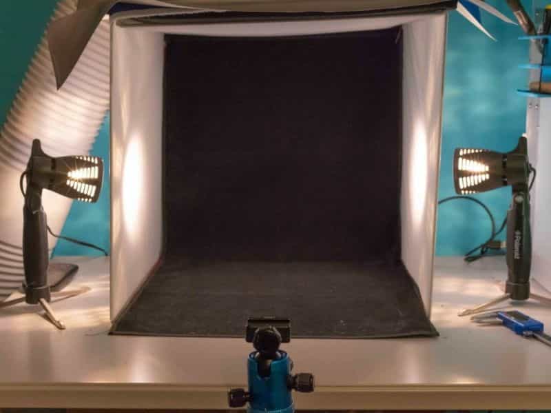 Photo light box setup with side lighting and black velvet backdrop 