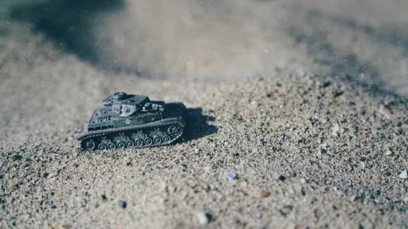 How to Paint Model Tanks (8 Basic Steps) - painting tanks - how to paint model tanks - Scale model world war 2 German tank photographed on a beach with sand