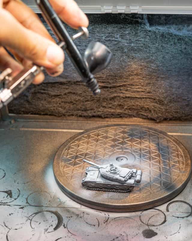 How to Paint Model Tanks (8 Basic Steps) - painting tanks - how to paint model tanks - Spraying a highlight primer from above a model
