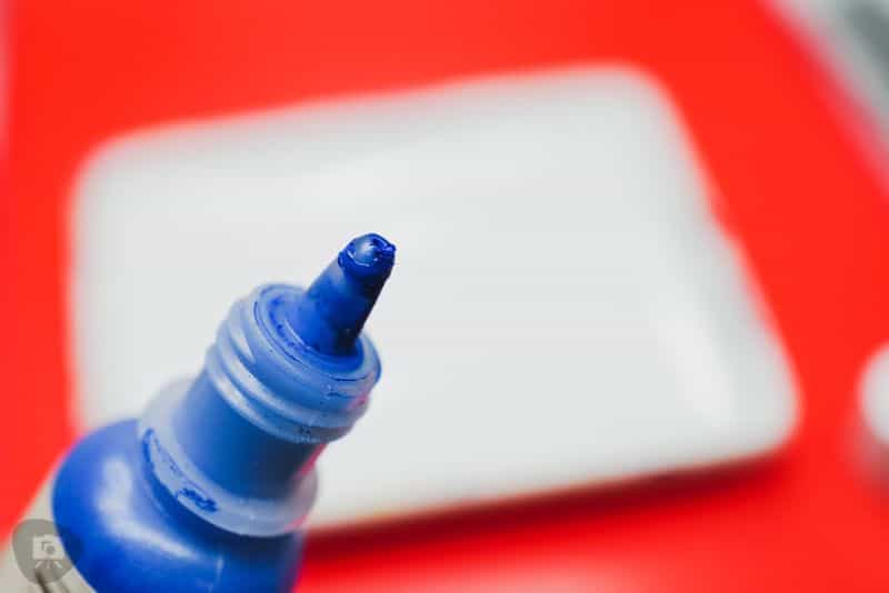 Best Kind of Paint for Miniature Painting? - acrylic paint, oil paints, scale modeling, painting miniatures - Close up of blue hobby paint dropper tips
