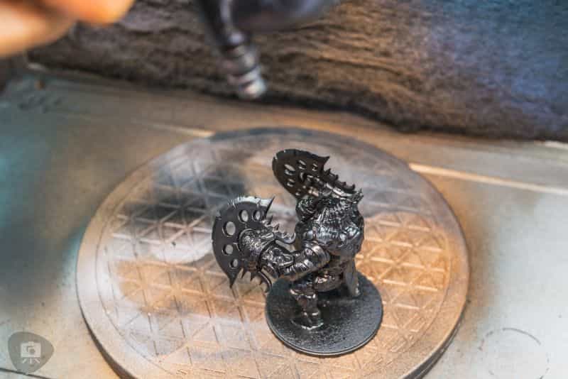 Zenithal Priming and Painting Miniatures – A Tutorial - painting minis with zenithal contrast - applying zenithal primer spraying from the top down simulates sunlight