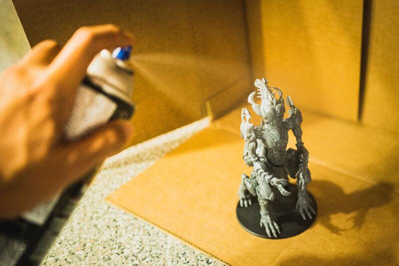 Priming Miniatures and Spraying Hobby Models (A to Z Guide) - priming miniatures step by step - spraying model kit with nozzle 8-12 inches away