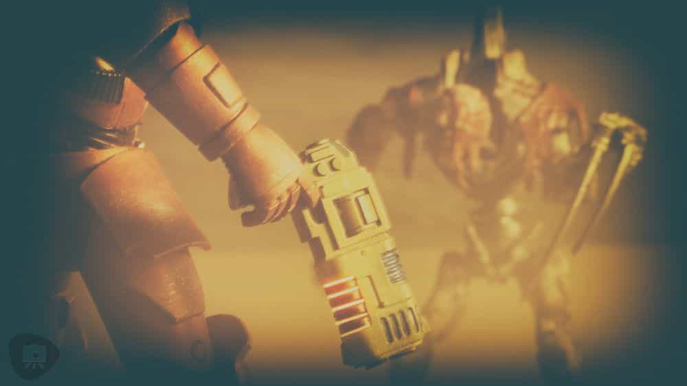 Gregory Culley: Grimdark Photography Methods and Madness - how to take grimdark miniature photos - close up of plasma pistol against tyranid