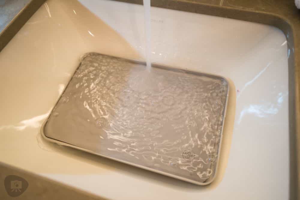 Hotel Room Miniature Painting (Travel Challenges, Tips, and Solutions) - travel tips for miniature painting away from home - Traveling and painting miniatures - wet palette in sink with pouring water from faucet