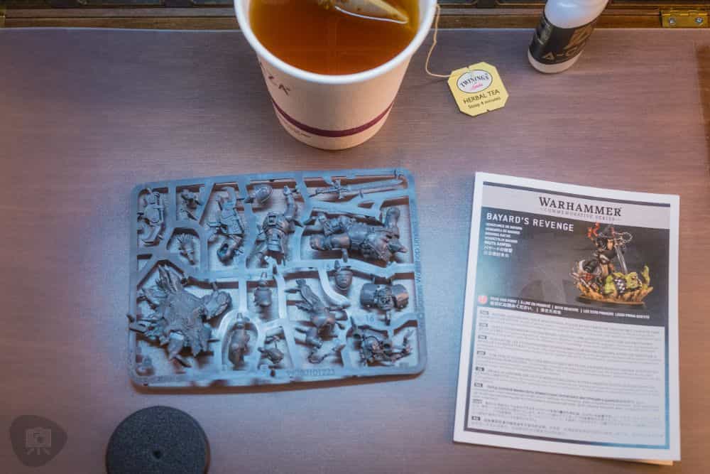 Hotel Room Miniature Painting (Travel Challenges, Tips, and Solutions) - travel tips for miniature painting away from home - Traveling and painting miniatures - plastic kit sprue with instruction pamphlet