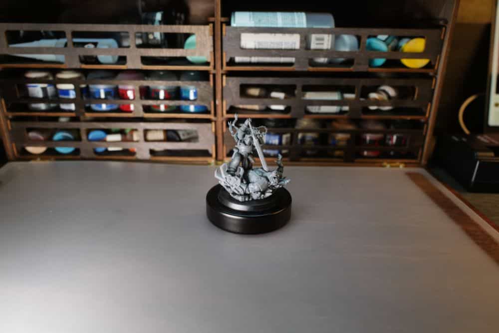 Ork and space marine warhammer 40k model on a desk working surface