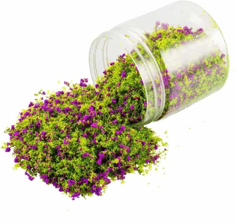 Miniature Basing Materials for Model Hobby Projects (Tips and Review) - best basing material for miniatures and models - scatter foliage with green and purple color spilling out from a plastic jar