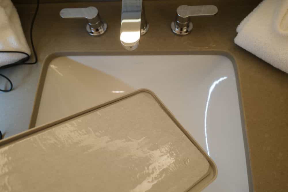 Hotel Room Miniature Painting (Travel Challenges, Tips, and Solutions) - travel tips for miniature painting away from home - Traveling and painting miniatures - hotel sink with wet palette preparation