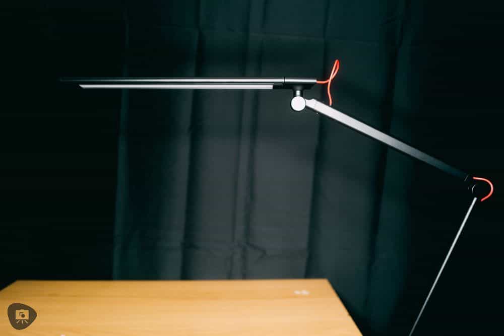 Redgrass games desk lamp review, redgrass games lamp review for painting miniatures, models, and art - Lamp over a tabletop with black backdrop