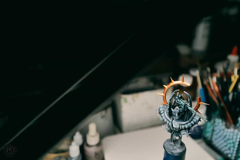Redgrass games desk lamp review, redgrass games lamp review for painting miniatures, models, and art - close up angle photo of miniature painting in progress