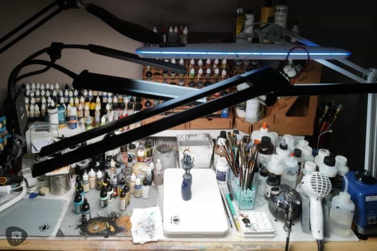 13 Best Lights for Miniature Painting and Hobbies - best miniature painting lamp - testing group photo on desk over a warhammer model