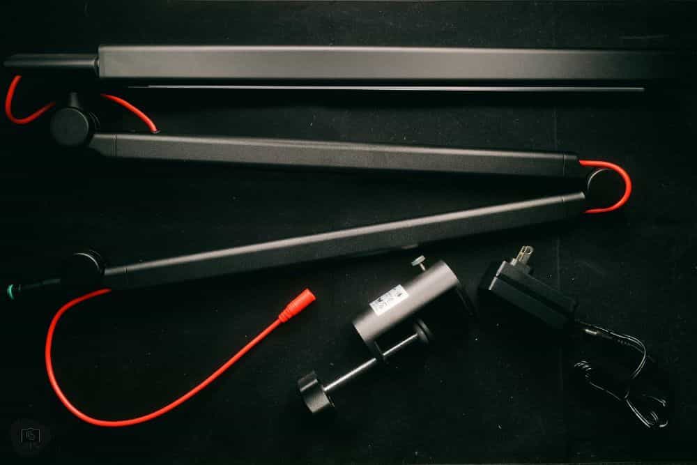Redgrass games desk lamp review, redgrass games lamp review for painting miniatures, models, and art - The lamp in parts on black backdrop with red accent wiring