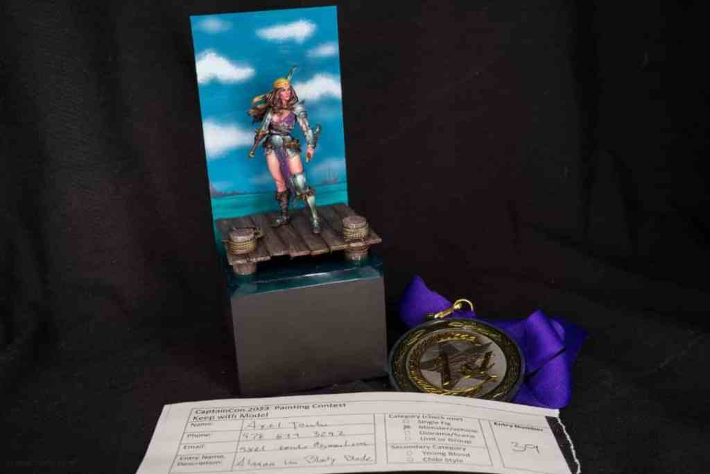 Running a Successful Hobby Gaming Convention: The Hidden Magic and Mayhem Behind CaptainCon - First place painted miniature in the painting contest with medal