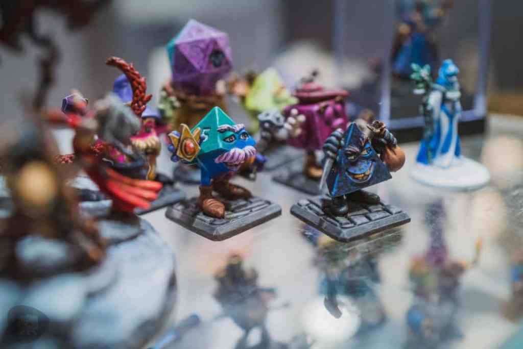 Running a Successful Hobby Gaming Convention: The Hidden Magic and Mayhem Behind CaptainCon - Reaper miniatures painted in display case