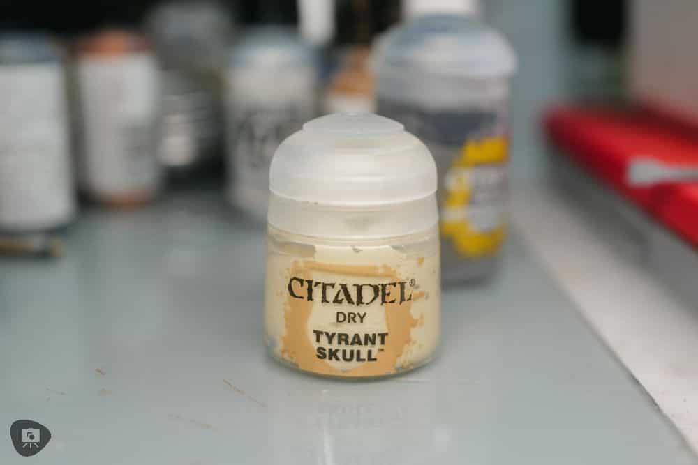 My Favorite Citadel Technical Paint and How to Use Astrogranite Debris (Review) - citadel texture paint astrogranite review and tutorial - Drybrush dry tyrant skull paint pot on hobby desk