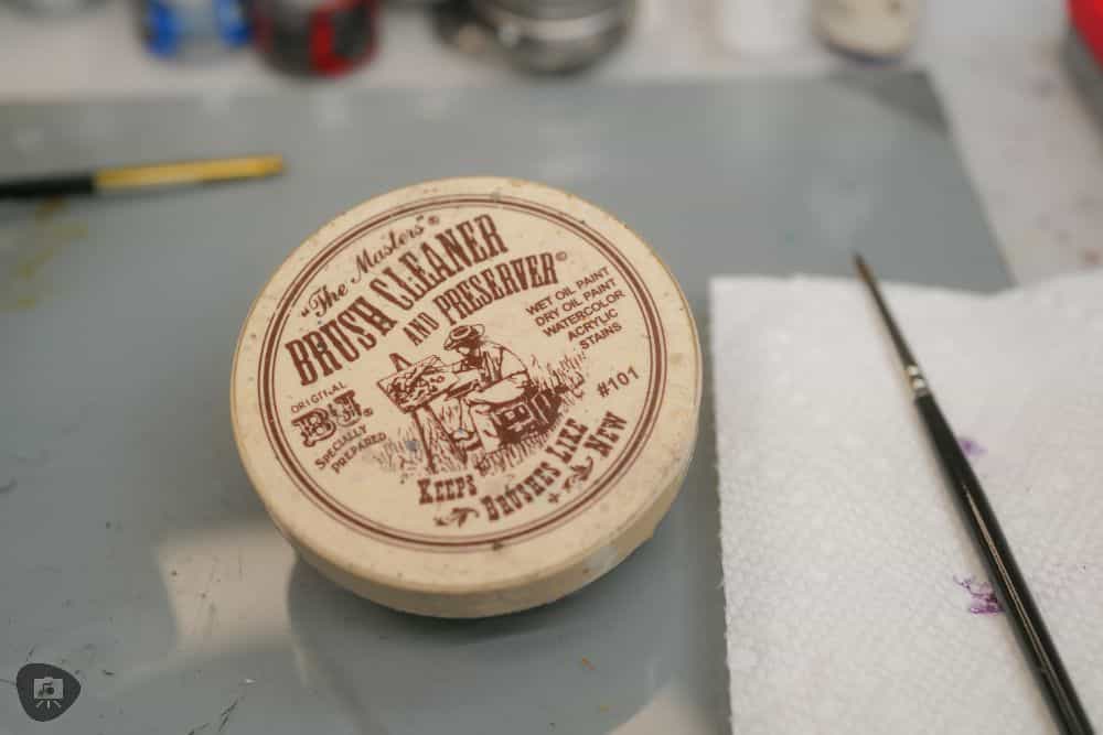 Photo of my Master's Brush Cleaner container and brush on my hobby desk