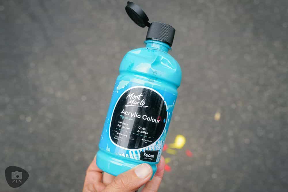 Understanding Acrylic Paint for Miniature Hobbies: Uses, Types, and Best Picks (Guide) - What is acrylic paint, it's uses, and best types - a 500ml bottle of blue acrylic craft paint