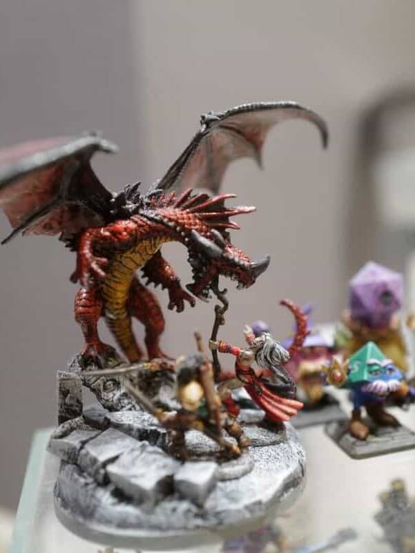 AI Enhanced Wargaming and Tabletop RPGs (Tips and Uses) - Reaper RPG miniatures painted up, pathfinder dragon with warrior and mage face off