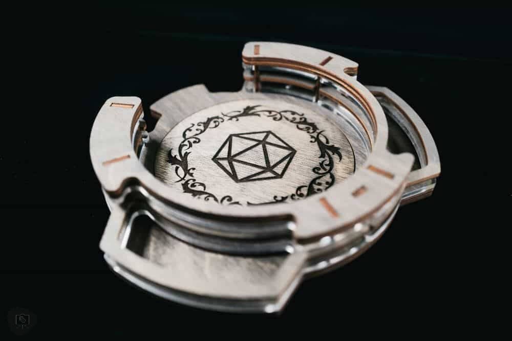 SMONEX Dice Tower Review - Close up engraved logo of d20 with dark line work on wooden material
