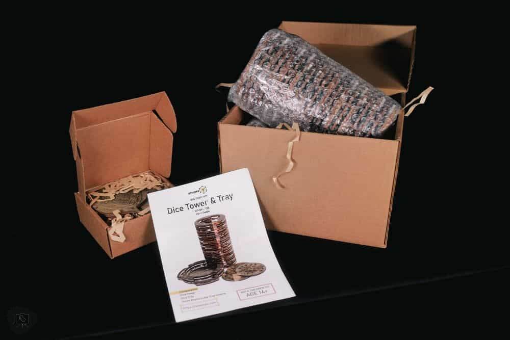 SMONEX Dice Tower Review - unboxing packaging of dice tray and accessories on black background