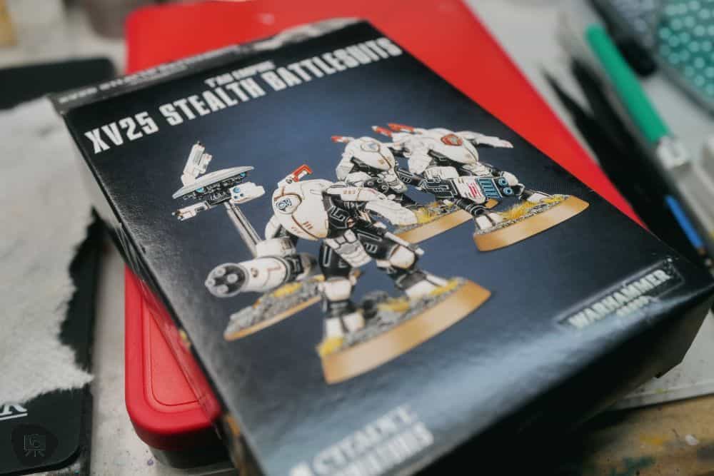 How to Paint Plastic Miniatures (Step-by-Step) - painting plastic miniatures and models - A box of T'au XV25 Stealth Battlesuits models