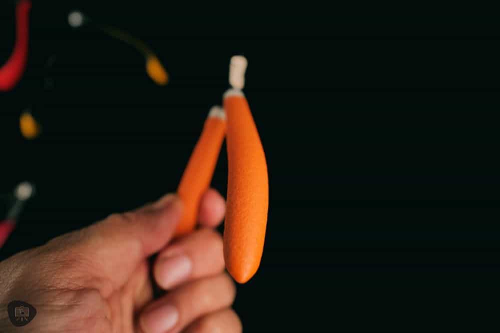 Close up of the orange textured handle of the RGG precision nipper and curled metall handle shape