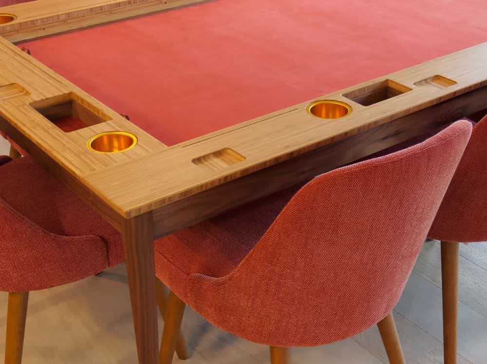 a modern tabletop with unique color fabric and design for a table with hardwood finishings and brass fittings