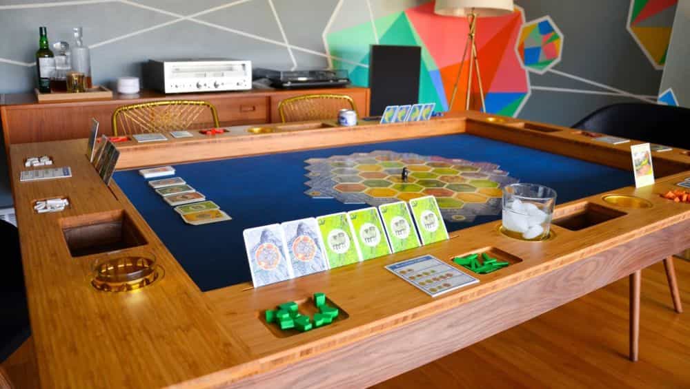 Elevate Your Tabletop Gaming Experience with a Board Game Dining Room Table (Editorial) - Settler's of Catan game in progress on the table