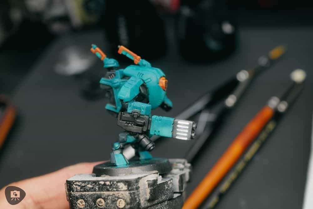 How to Paint Plastic Miniatures (Step-by-Step) - Before applying a orange shade over the plasma weapon 