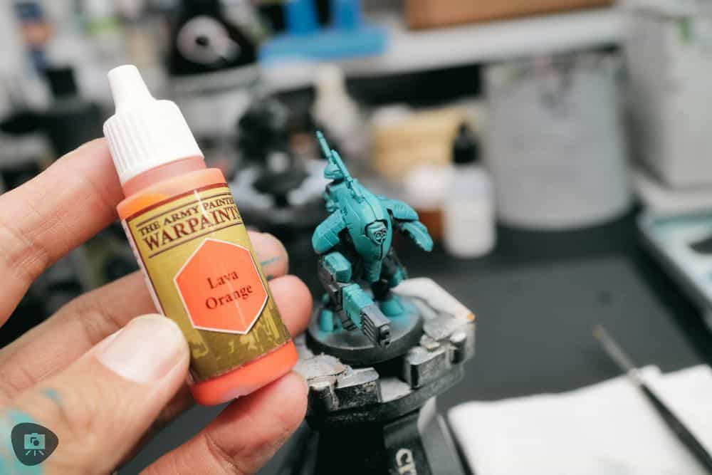 How to Paint Plastic Miniatures (Step-by-Step) - applying orange accent base coat paints